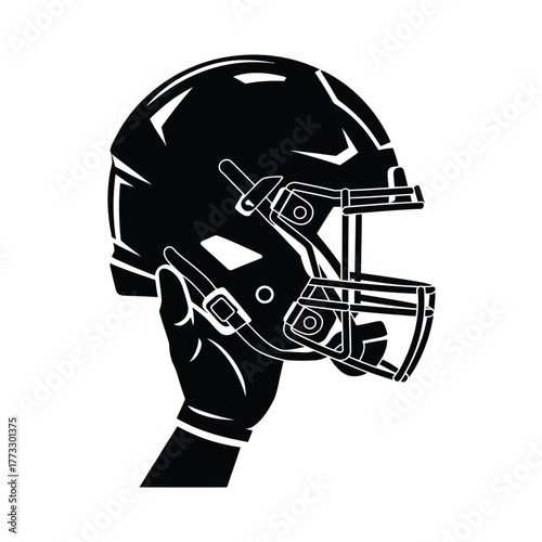 Hand holding american football helmet silhouette