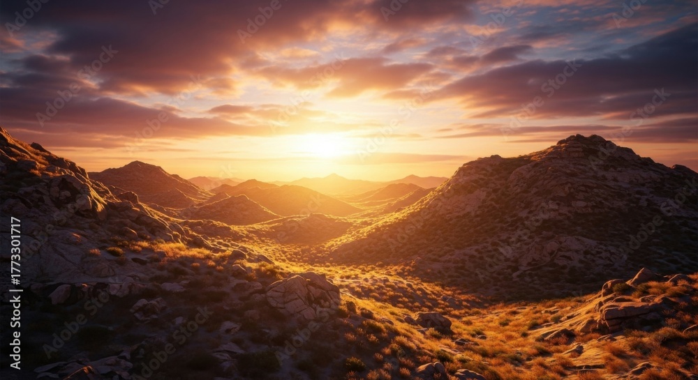 Naklejka premium Dramatic sunset over rugged mountain landscape with warm golden light