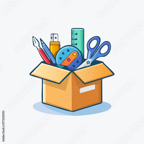 An open cardboard box filled with various school and office supplies.