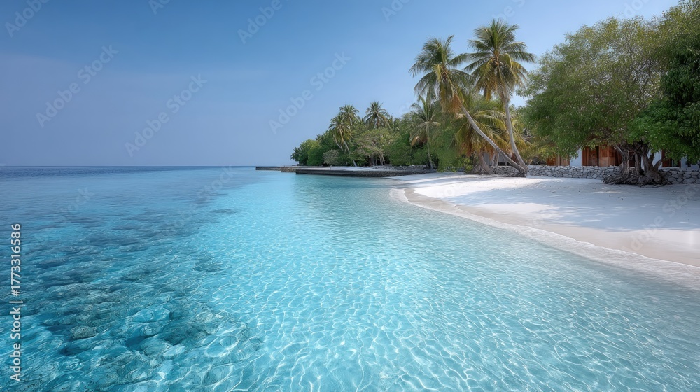 Fototapeta premium Turquoise Ocean Water Splashing On A White Sand Beach With Lush Green Palm Trees Under A Clear Blue Sky During A Tropical Summer Day