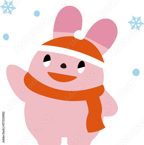 手を上げてあいさつする冬のうさぎ