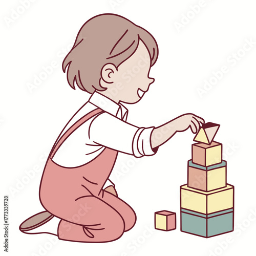 Young child playing with colorful building blocks creating a tower.