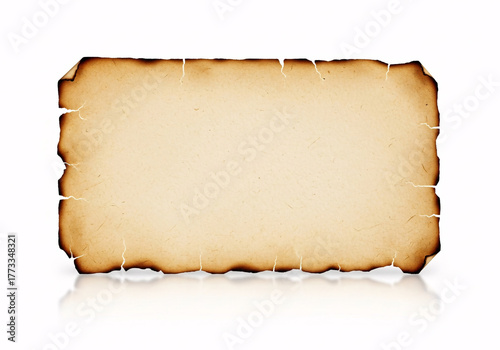 A blank, aged, burnt paper or parchment with rough edges isolated on white background