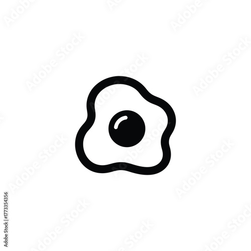 A black and white egg with a white yolk