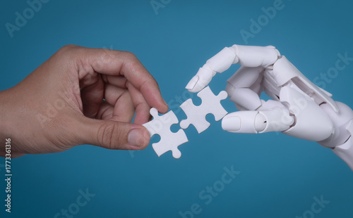 Human and Robot Hands Connecting Two Puzzle Pieces: AI and Human Collaboration