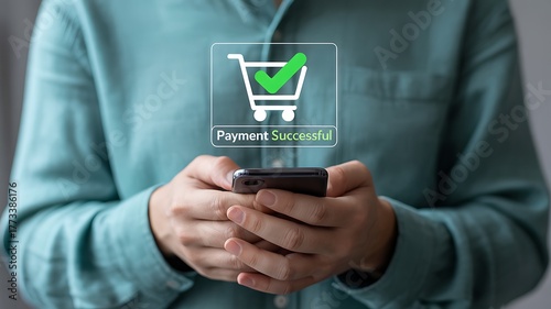 Wallpaper Mural Person holding a smartphone with a successful payment notification on screen mobile phone Torontodigital.ca