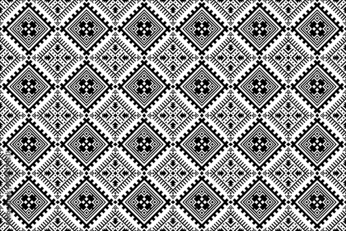 Seamless geometric pattern featuring tribal diamond shapes in black for fabric, craft, and textile design.