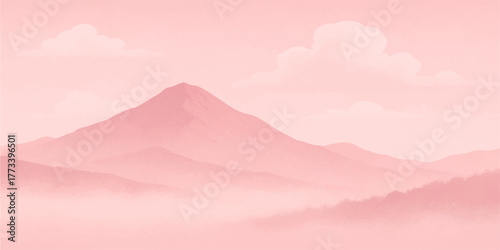 Golden sunset view over misty mountain peaks and valleys beneath a blue sky with dramatic clouds