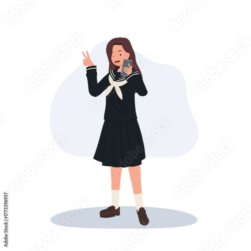 japanese schoolgirl in navy sailor uniform takes a kawaii style selfie making a peace sign during a cheerful after school moment in japan