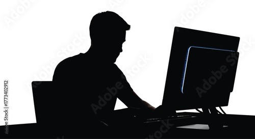 Silhouette of a man using a computer working at a desk ideal illustrating technology use remote work or online activity