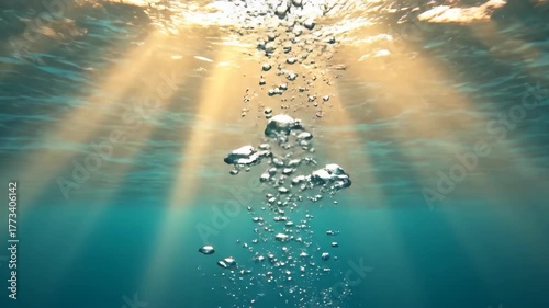 Underwater bubbles rise toward the surface with sun rays gleaming