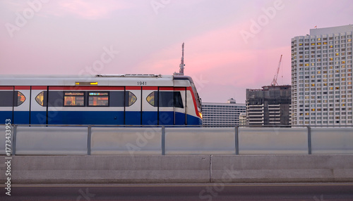 Bangkok SkyTrain with blurred city background on sunset sky and copy space, Sky Train is a mass transit system in Bangkok to assist facilitate and fast journey
