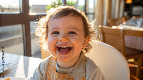 Family time mealtime together smiling toddler with messy face eating pasta in high chair enjoying meal