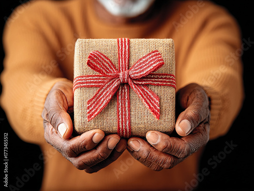 a man holding a Christmas gift