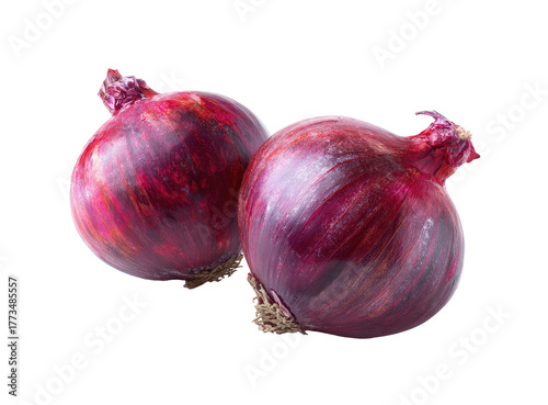 Two ripe red onions with dark purple skin and white interiors
