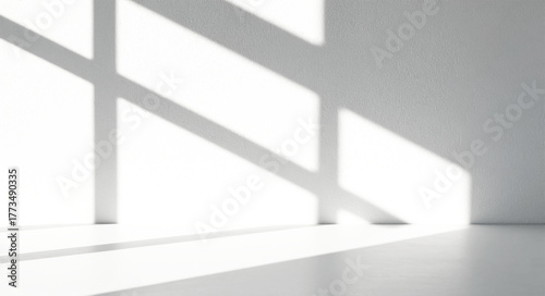 Window shadow pattern on white surface for design overlay.