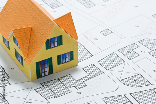 CADASTRAL MAP FOR REAL ESTATE DEVELOPMENT WITH BUILDING PLOTS AND HOME MODEL – PROPERTY INVESTMENT AND CONSTRUCTION PERMIT CONCEPT