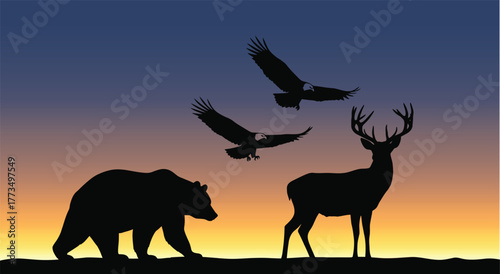 Silhouette of bear deer and eagles against a sunset sky with orange and purple hues in the background