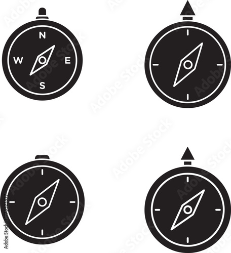 Set of four black silhouette compasses illustrating navigation and direction symbols