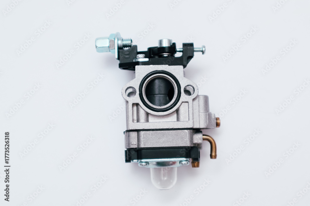 Fototapeta premium New carburetor for small engine. Replacement part for trimmer or chainsaw.