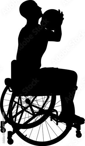 A silhouette of a male wheelchair basketball player holding the ball near his chest, aiming carefully before taking a shot.