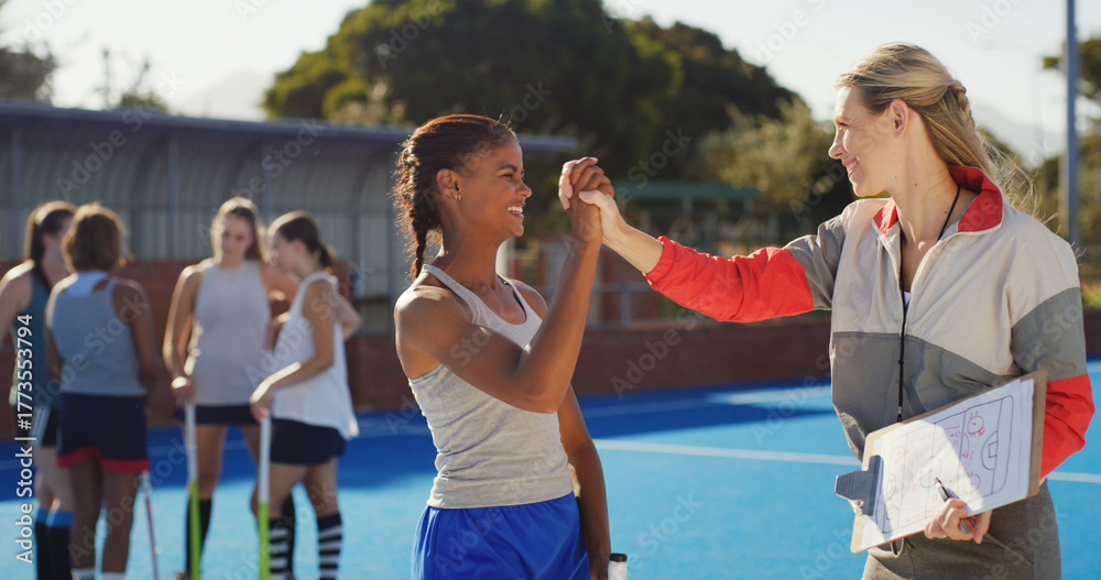 Naklejka premium Hockey, woman and coach with high five outdoor for strategy success, match progress and well done. Sport coaching, clipboard and people with support on pitch for game performance and practice goals