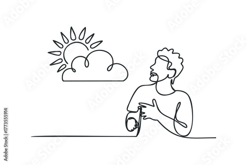 Man looking up at sun and cloud