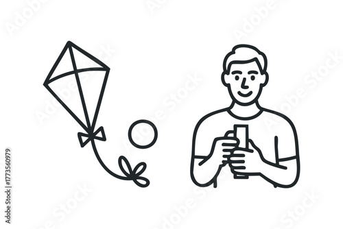 Person holding a mobile device with a kite nearby