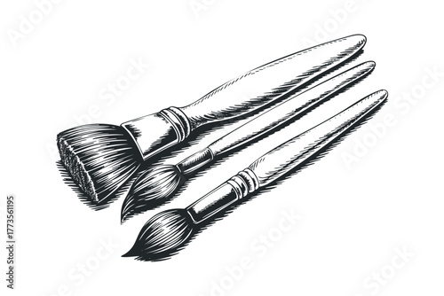Collection of three paint brushes with varied bristle sizes