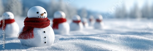 Smiling snowmen in red scarves on a snowy winter day