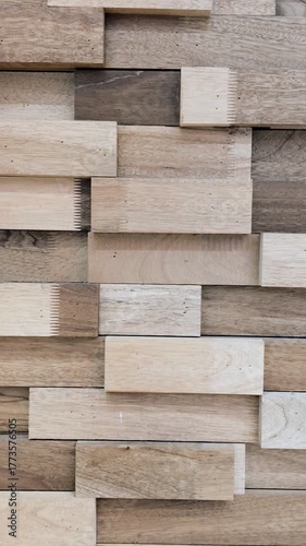 Top-to-Bottom Pan of Textured Wooden Wall Panels
Video pans vertically over staggered wooden wall panels. The varied tones and textures highlight natural grain and geometric design.