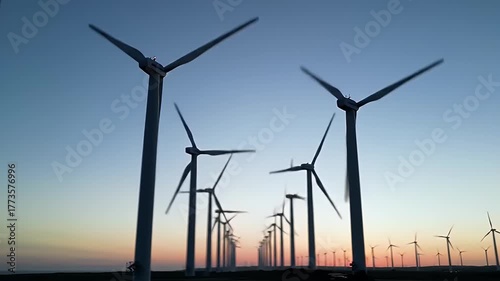 Wind Turbines Spinning at Dusk Renewable Energy Concept