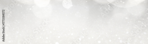 Christmas background with white glitters and bokeh lights. Banner design