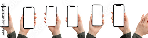 Multiple hands holding blank screen phones against a black background