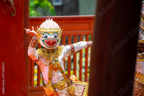 A child performer wearing a Hanuman mask in a traditional Thai Khon dance. The costume is decorated with gold embroidery, showing the beauty of Thailand's classical performing arts.