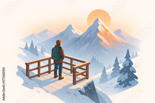 Young adult male enjoying sunrise view of snowy mountains in winter landscape