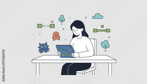 A girl using a tablet to design her own video game with sketches of characters and levels tered around her workspace.