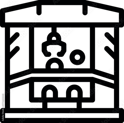 Claw crane arcade game grabbing a prize, providing entertainment and challenge in amusement park setting