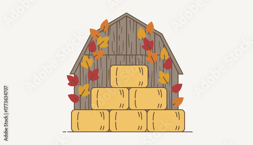 An antique barn its weathered wood adorned with vibrant autumn leaves serving as a backdrop for hay bales stacked high.
