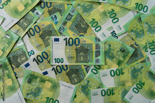 Full frame top down view of multiple 100 Euro banknotes filling the entire frame representing abundance finance and currency