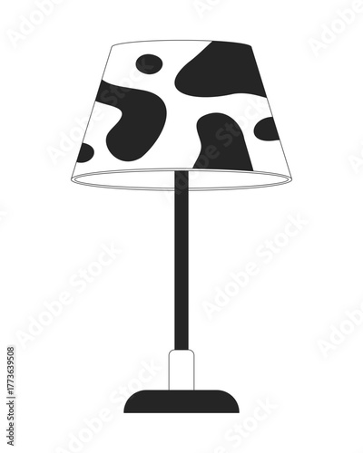 Cow-print table lamp with bold pattern 2D line object. Animal print lampshade desk light. Interior accessory. Home lighting isolated clipart vector ink outline item. Monochrome spot illustration