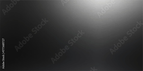 Brushed dark grey stainless steel texture backdrop with metallic light pattern