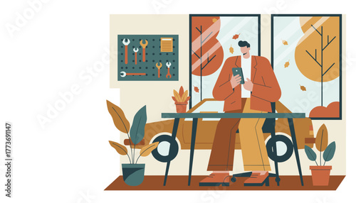 Stylish man using phone in modern automotive workshop with car tools and autumn view