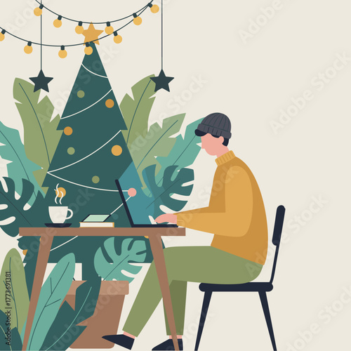 Young man works on laptop near festive Christmas tree and tropical plants
