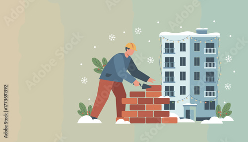 Holiday construction Worker building brick wall by snowy decorated apartment building