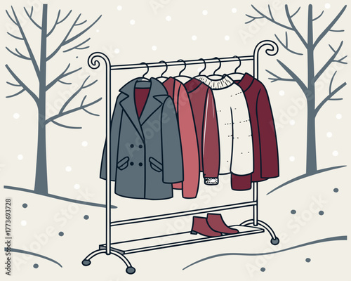 Clothing rack with winter apparel in a snowy outdoor setting