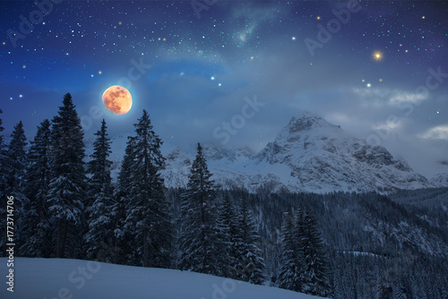Full moon and abstract stars sky in a winter mountains.