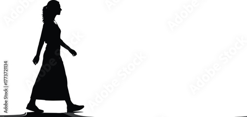 Silhouette of woman walking in long dress, side view, shadow on ground, fashion concept, motion pose, white background, elegance