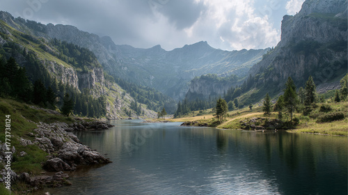 Fototapeta Naklejka Na Ścianę i Meble -  A serene lake reflects the towering mountain landscape under a cloudy sky, showcasing the natural beauty and tranquility of the alpine scenery.