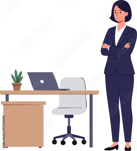 A businesswoman stands confidently with arms crossed beside her office desk and laptop computer.